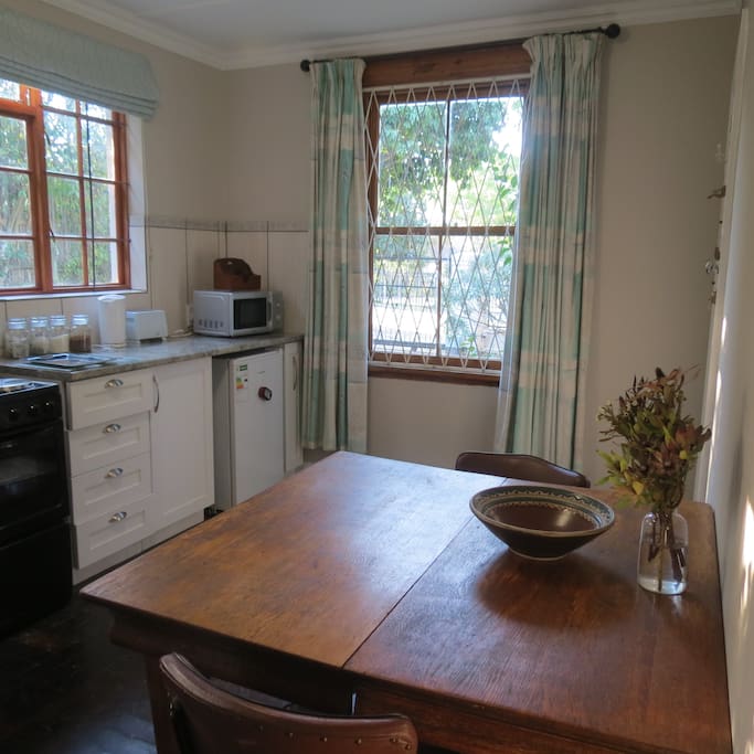 Kitchen with door leading to the outside on the right