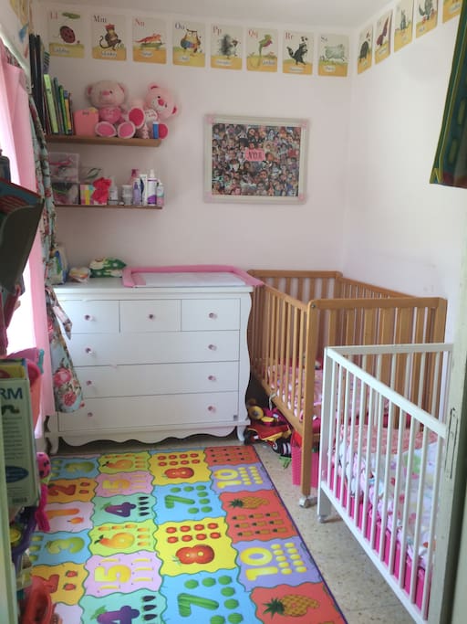 Second bedroom - ideal set up for small children, but crib can be removed and rearranged with American mattress to sleep 1-2