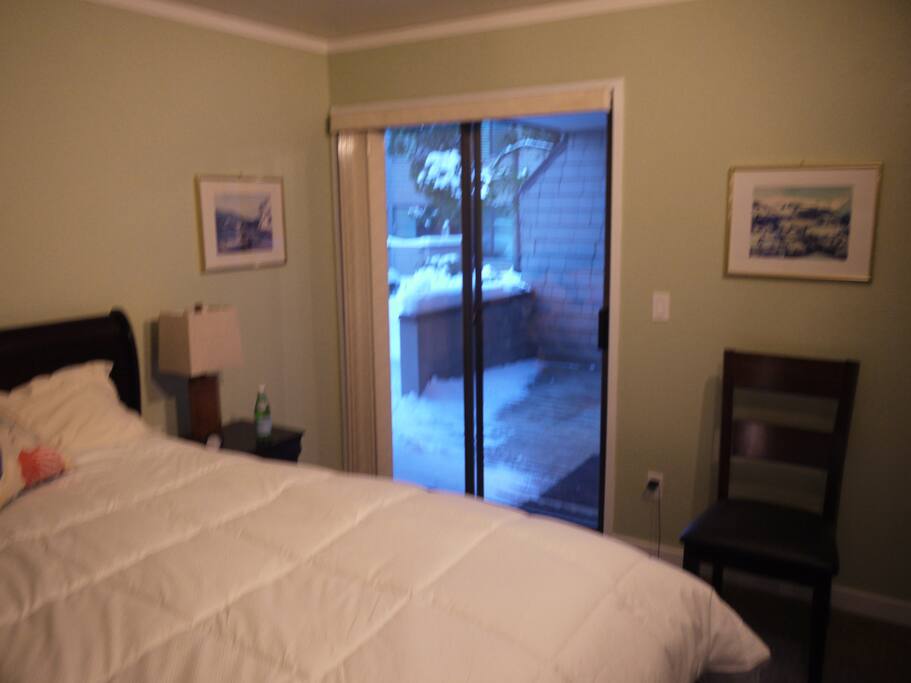 Master bedroom with view of deck