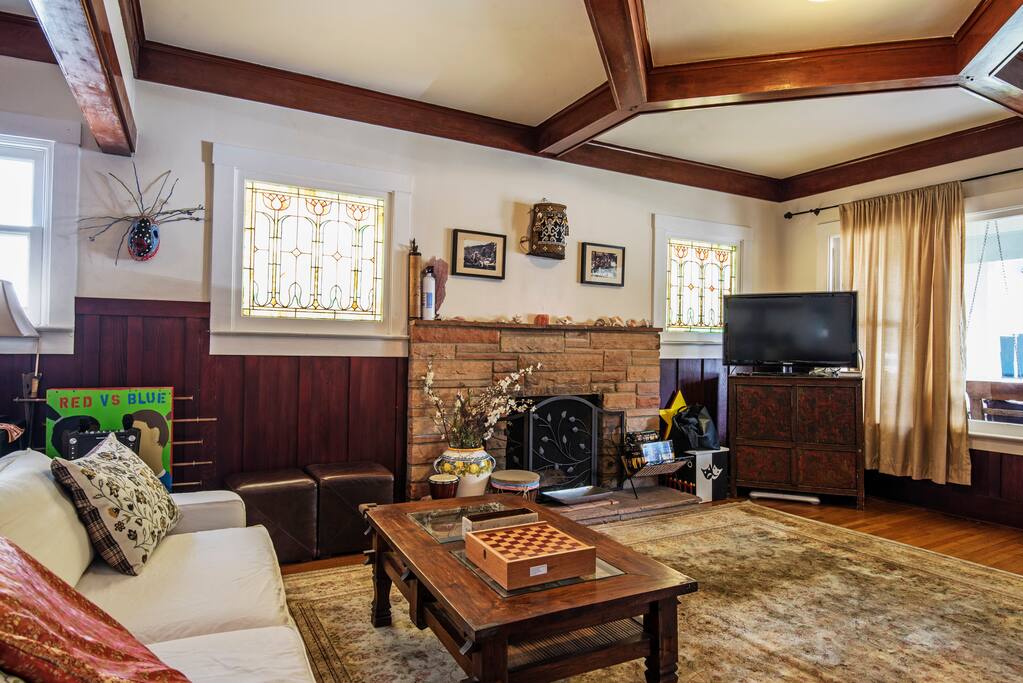 Another angle of living room with fire place in background