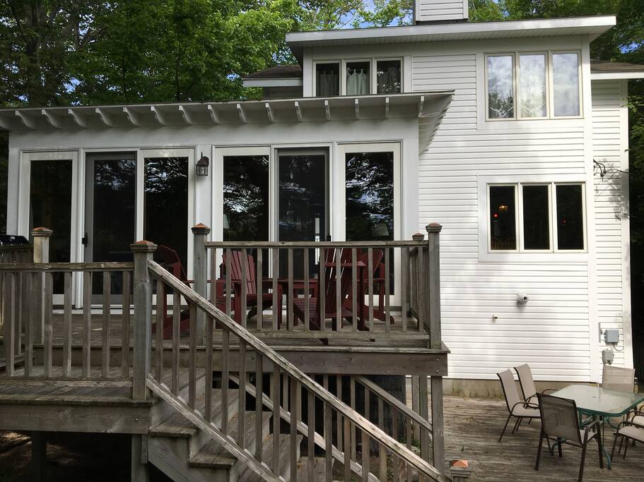View of Conklin Cottage facing the lake with upper and lower decks.