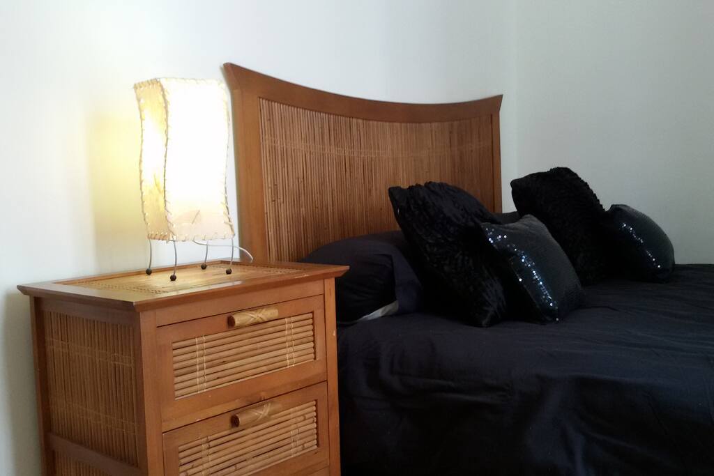 Comfortable main bedroom with double bed and small balcony and A/C