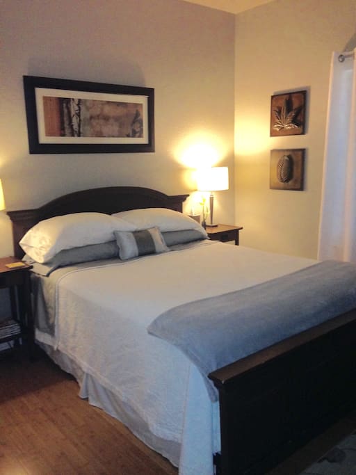 First class bedroom with plush linens.