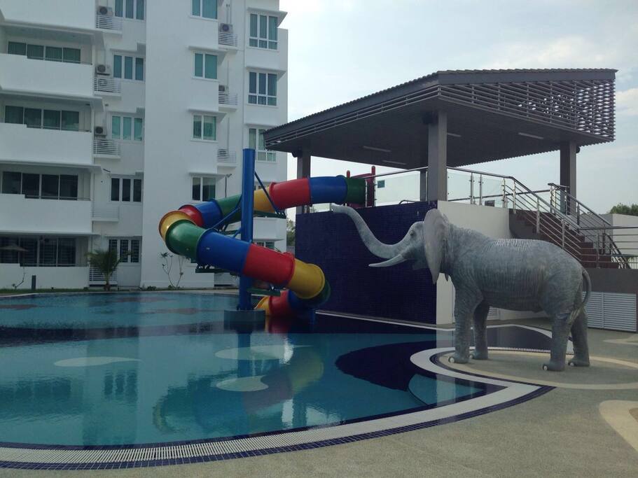 Sprawling swimming pool , double-loop slide & watch tower , oval-shape water playground, splash play pool to suit every generation of the family