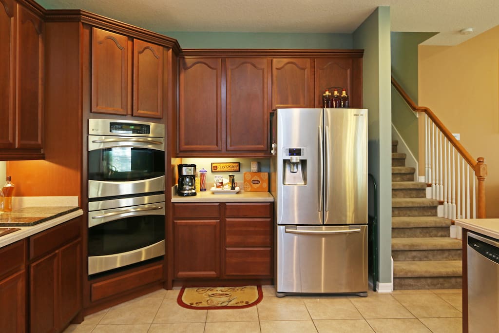 Gourmet kitchen with double oven Wolf flat-top range. Coffee and tea bar.