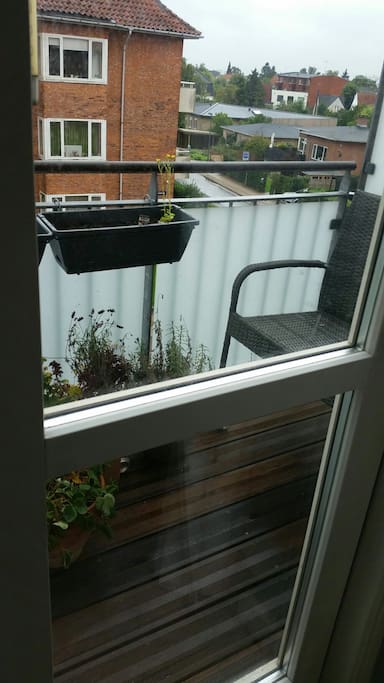 Balcony with plants and chill out corner