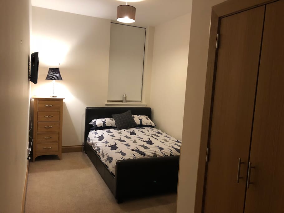 Bedroom with double bed, built in wardrobe
