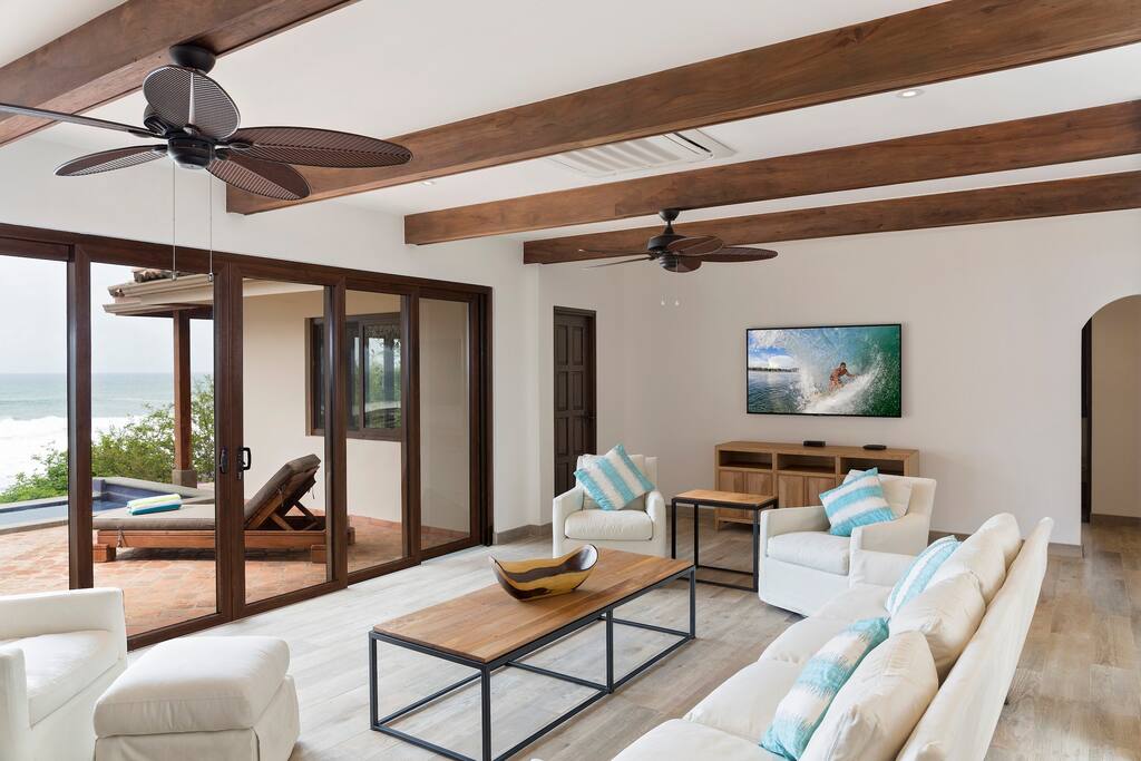 Open concept interior with large kitchen overlooking pool, many seats for all guests!