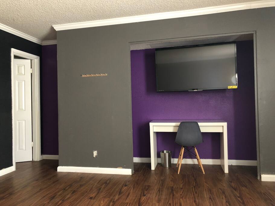 Convenient work desk, coat roack, 55' Smart TV with access to Netflix, Youtube and more