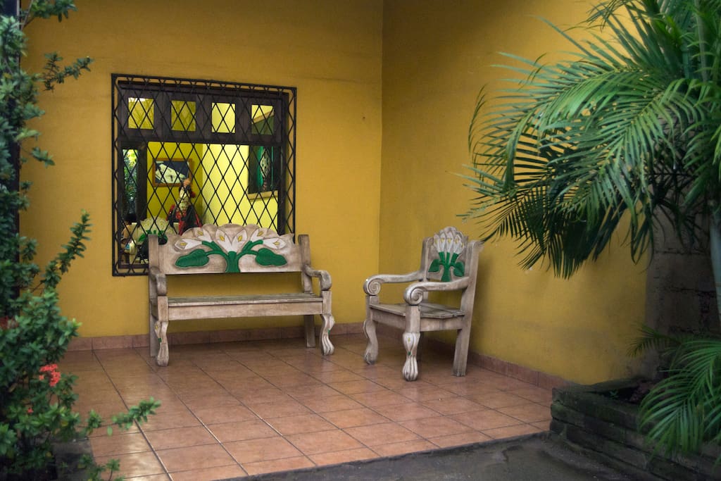 First front porch of the house/ grill available/ chill hammock space / also garage space is in this front part of the home.