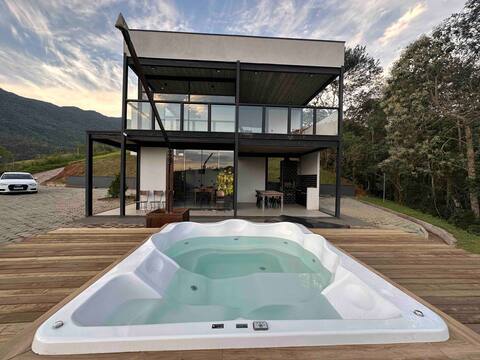 Mountain house with waterfall