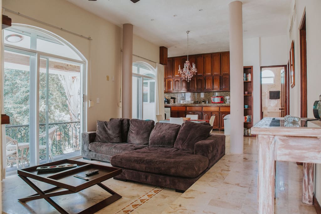 The spacious livingroom with big balcony and kitchen