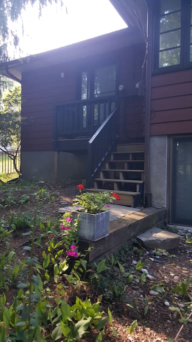 Steps up to left of main house.