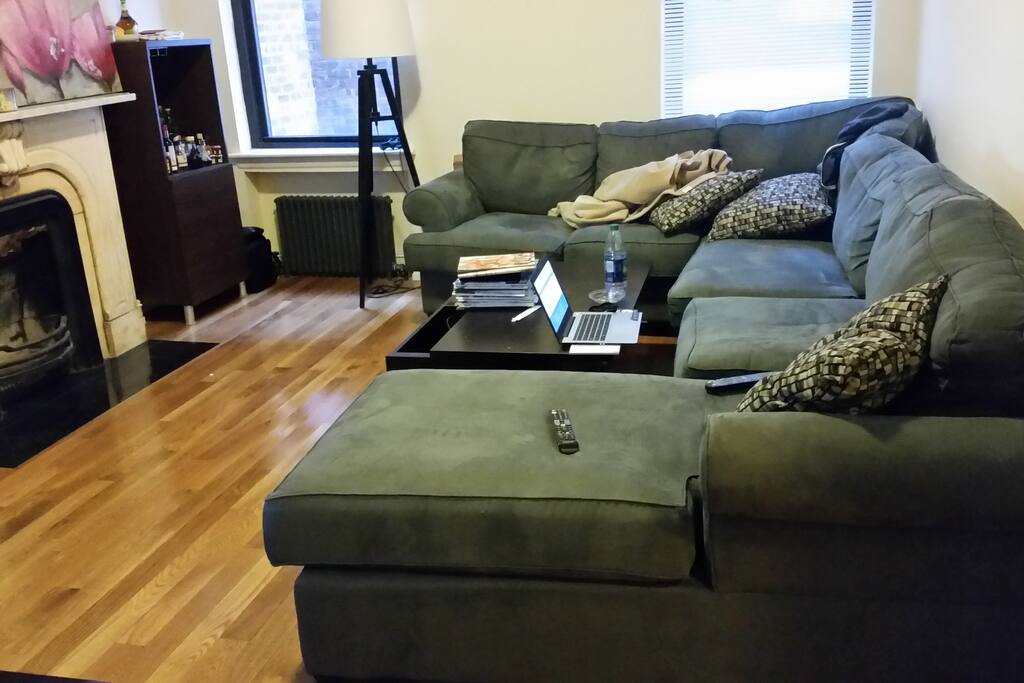 Big Couch in Living Room with Big Screen TV. Roommates are very friendly