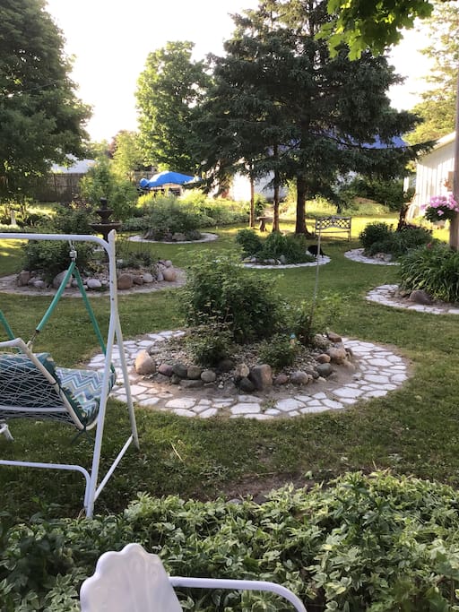 Outside the camper, you can enjoy a peaceful garden, swings, a deck with a cup of coffee, while you relax.