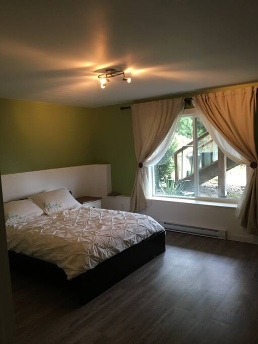 bright bedroom with queen size bed