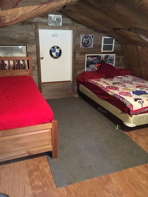 Upstairs sleeping area with double bed and 2 single mattresses that can make into 2 beds to sleep 4 people comfortably.