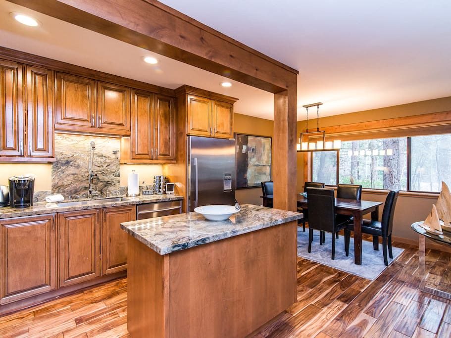 The gorgeous kitchen features plenty of prep space, including a convenient island area.
