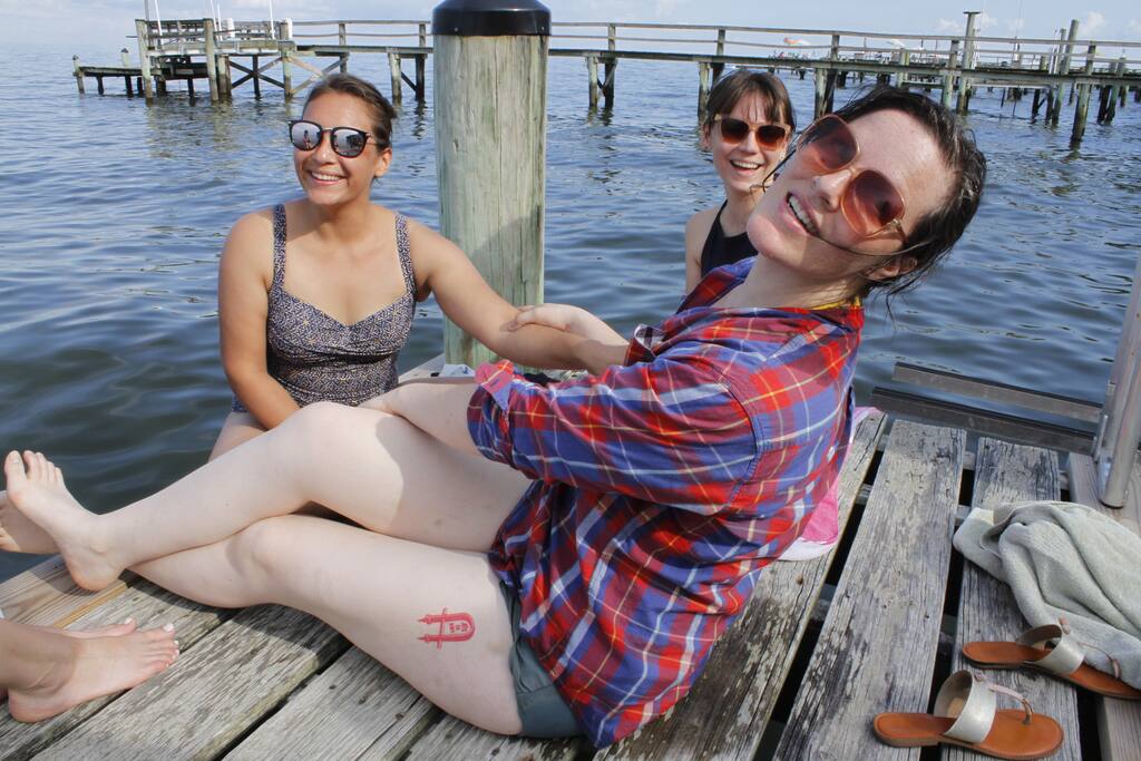 Sunbathing and swimming of the end of the dock