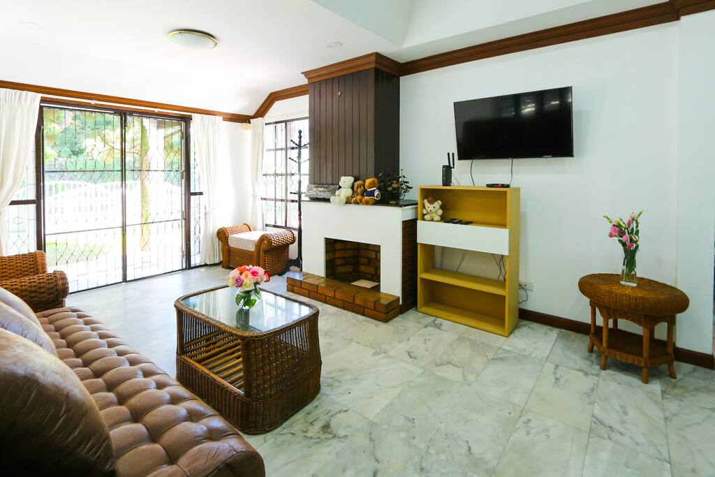 Living room with TV and cool marble floors
