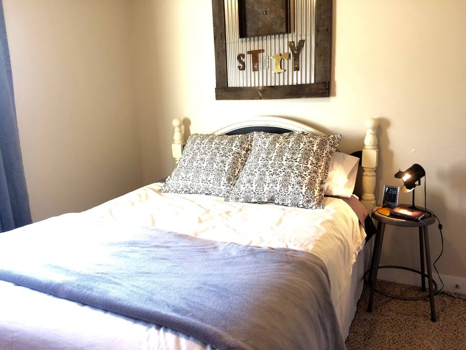 Comfortable queen sized bed in a private bedroom.