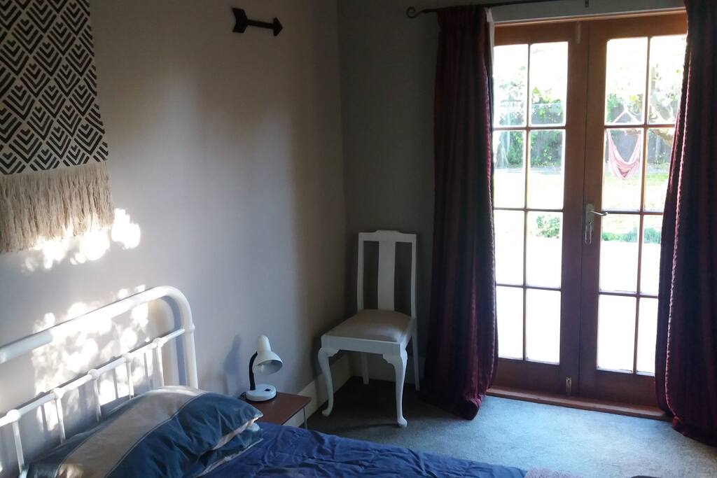 Sunroom with single bed, and own access to deck.