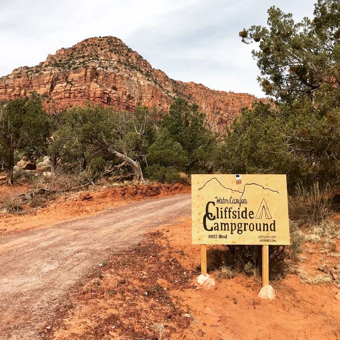 Campsite entrance. .9 miles from the start of Water Canyon Road. Look for this sign "Water Canyon CLIFFSIDE Campground". There is a cable gate that you'll receive a code for.