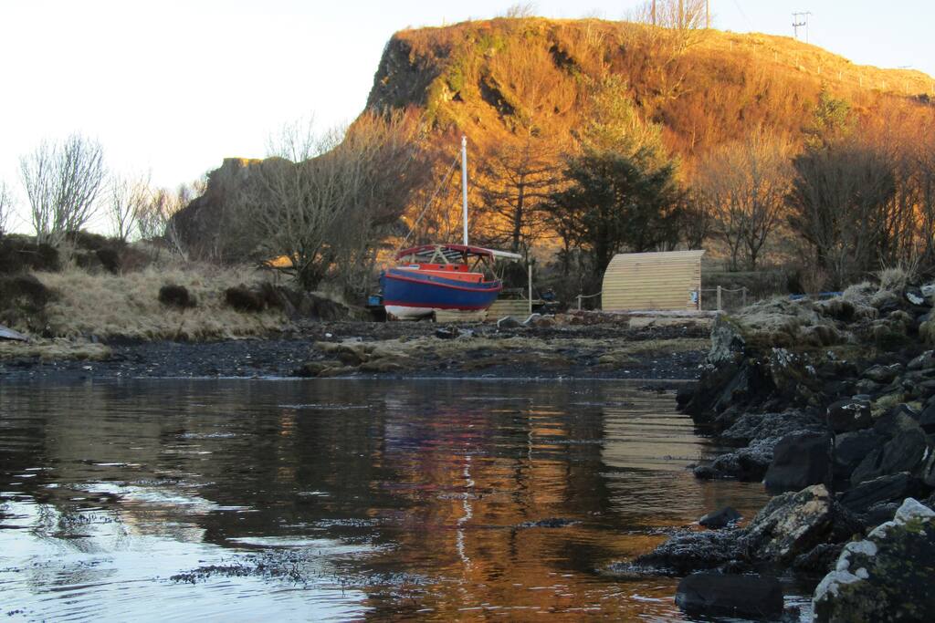 Tranquility, Alexandra and the beach head shelter just before the sun is on the cove.