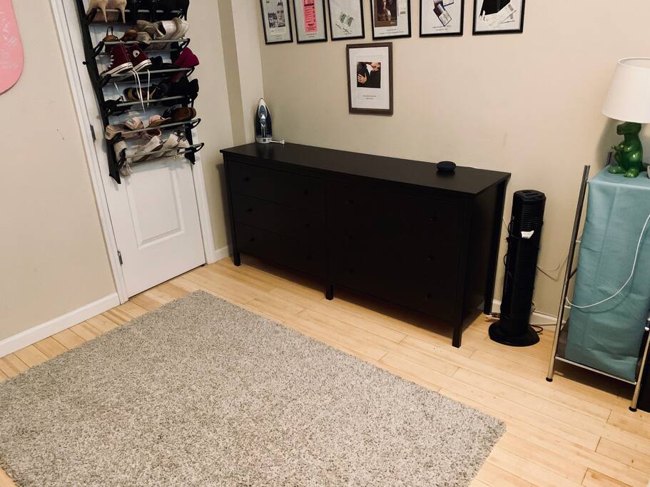 Bedroom dresser, fan, and nightstand