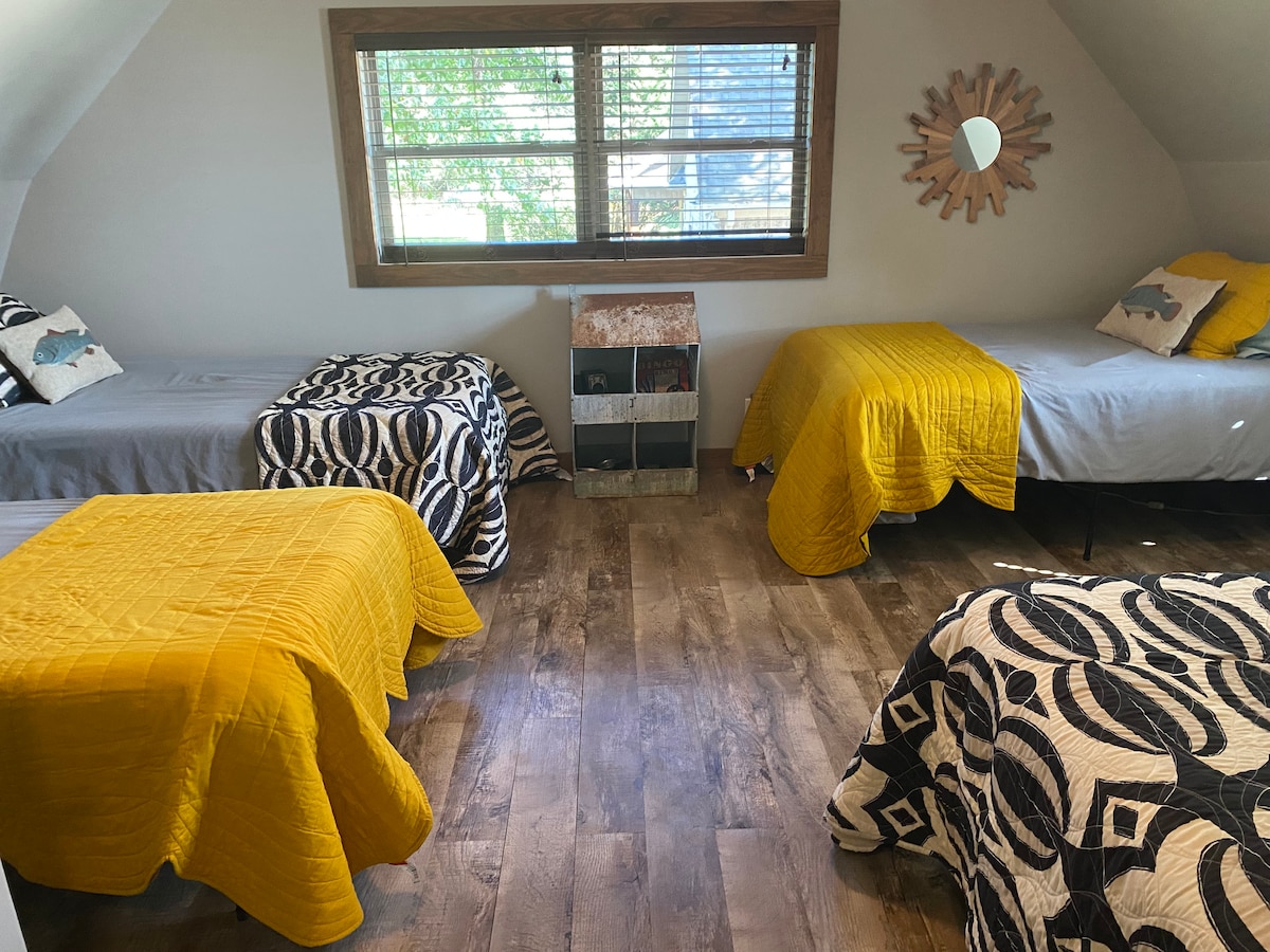 Bedroom 2 includes four cozy twin beds, closet, night stands, and HVAC unit with remote.