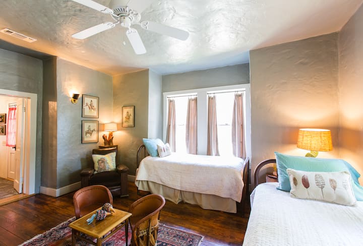 Twin room - two twin beds, TV, sofa, kids books, games, DVD player, attached bath and laundry room