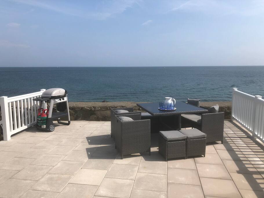 Outside upper deck with seating and bbq