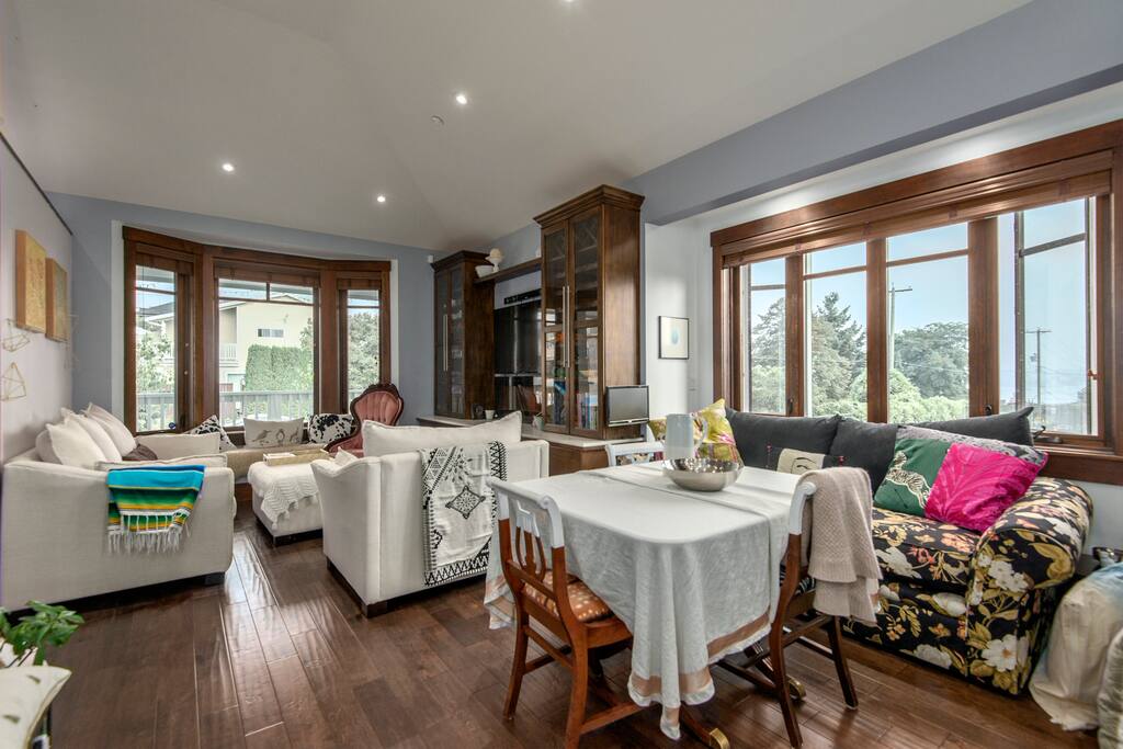 View to City and Water beyond dining area couch under window