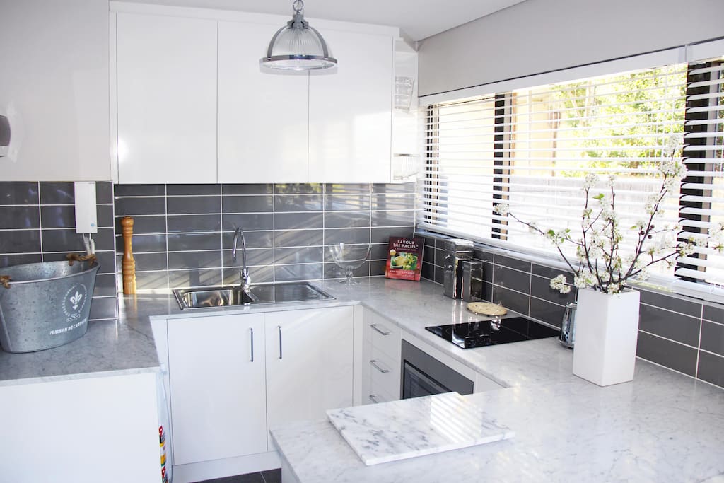 Filled with light and large enough for a gathering. Quality appliances are included.
