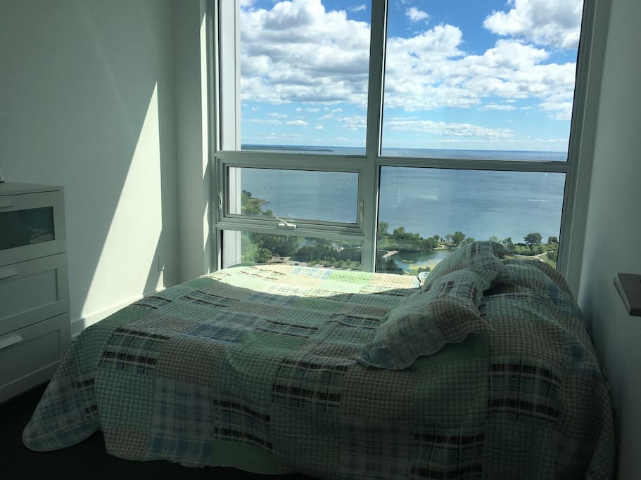 Bedroom with a queen bad ( a double queen air mattress), southeast view; Lake and CN tower view.