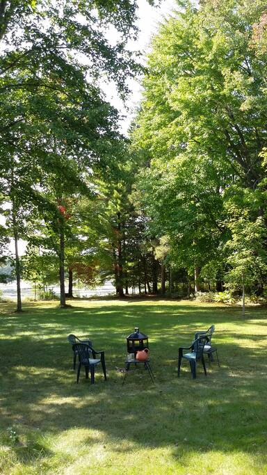 Enjoy the large wooded lawn over looking the water.