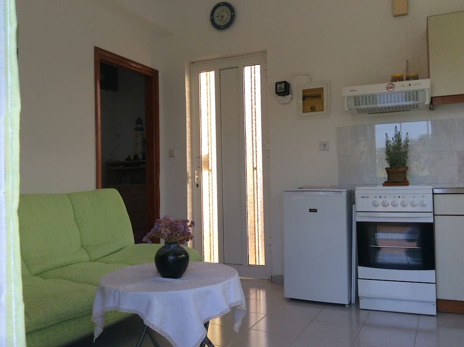 The living room; the sofa unfolds to semi-double bed
