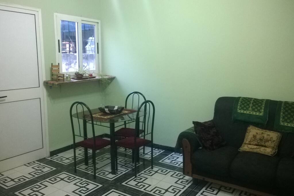 The living room is spacious, fresh and has good lighting. It is perfect for meetings with friends.