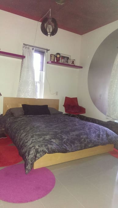 Bright modern room with Ikea spring mattress and heated mattress pad.
