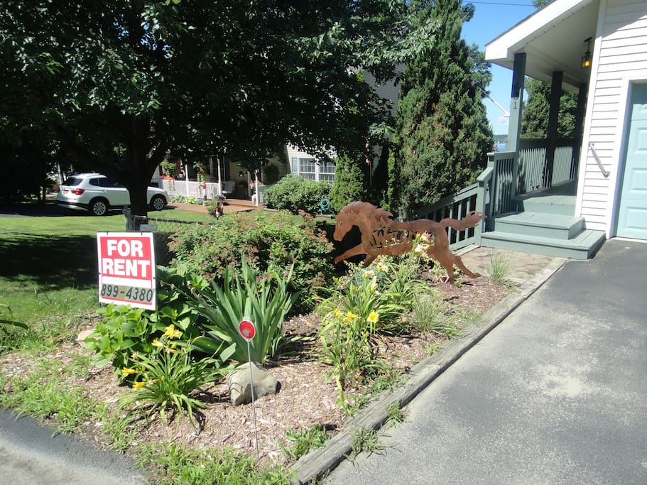 The front entry has offstreet parking for three vehicles in front of the garage. A stairway on the left brings you to a path leading to the lake...