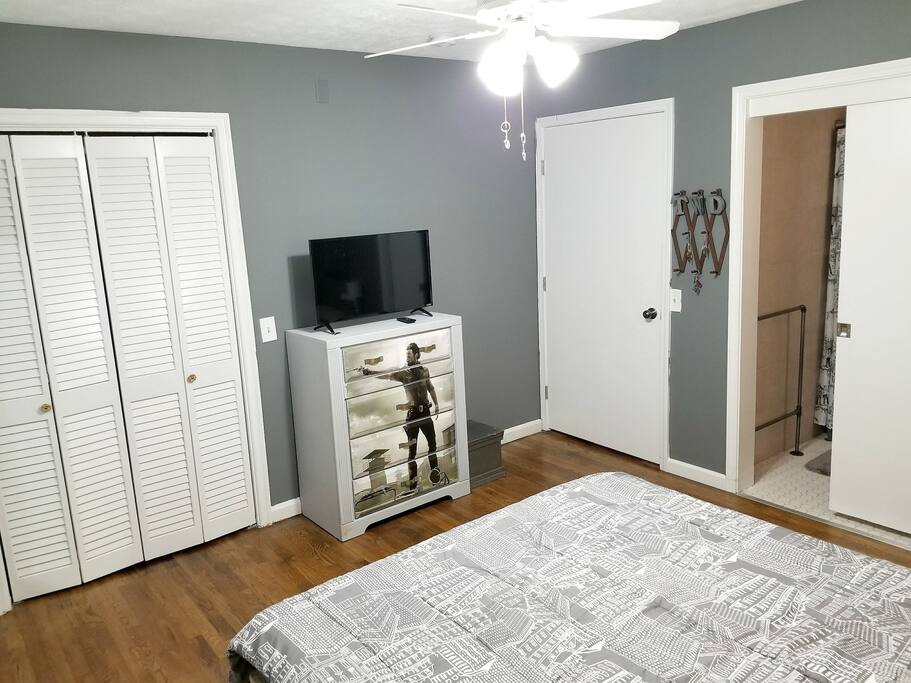 Your private bedroom also has a closet, Rick Grimes themed dresser, and Smart TV.