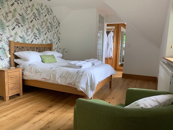 Restful and relaxing double bedroom with wardrobes, drawers and en suite toilet.