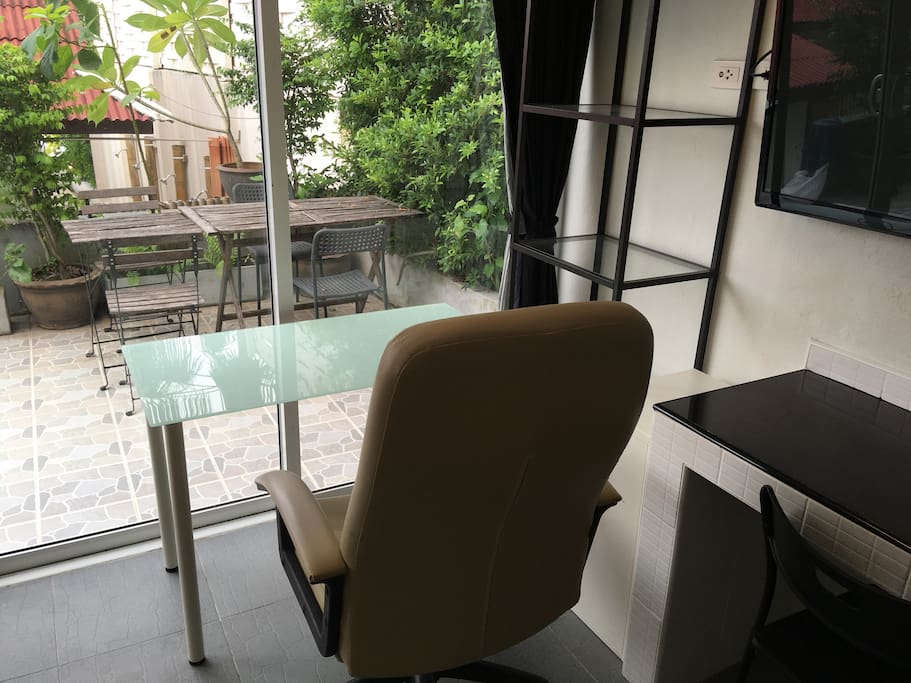 "Your" desk with green view, you can see coconut palms too :)