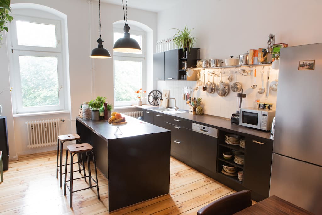 The open kitchen invites to cook together and enjoy good company. It is well equipped with various high-end kitchen appliances and utensils.