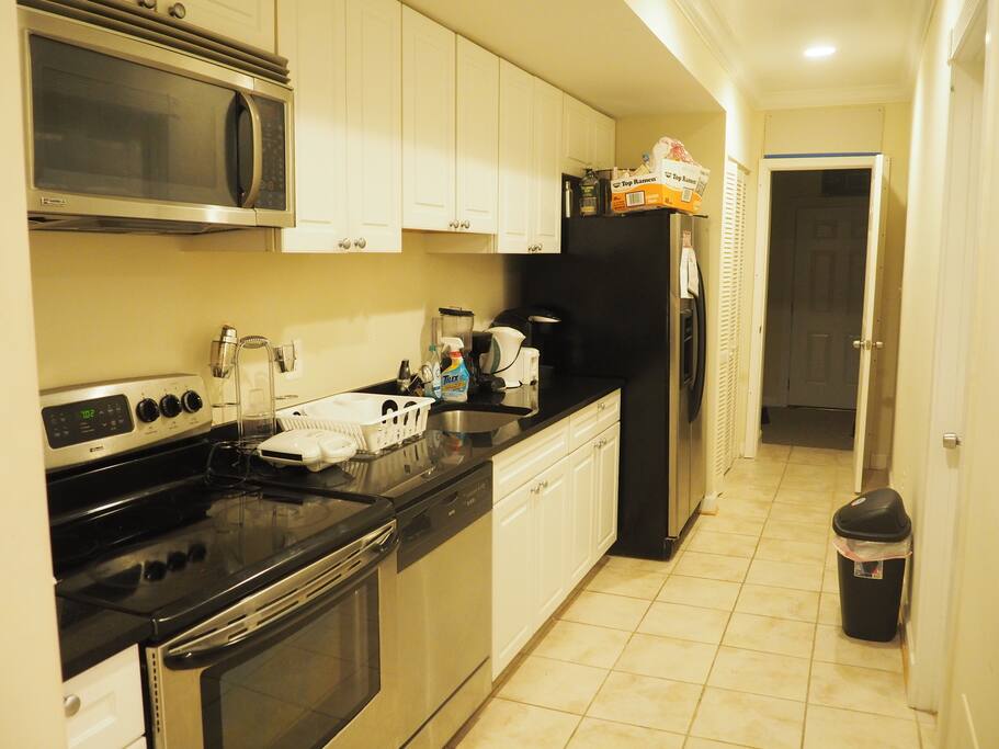 Our kitchen has a working stove, oven, waffle maker, blender, coffee machine, Keurig Machine, and full size fridge/freezer with a water filter