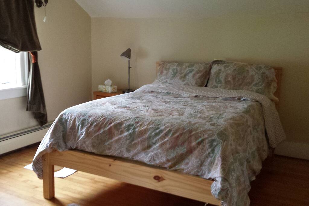 Double bed in sunny room