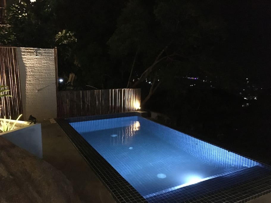 The cozy pool area by night.