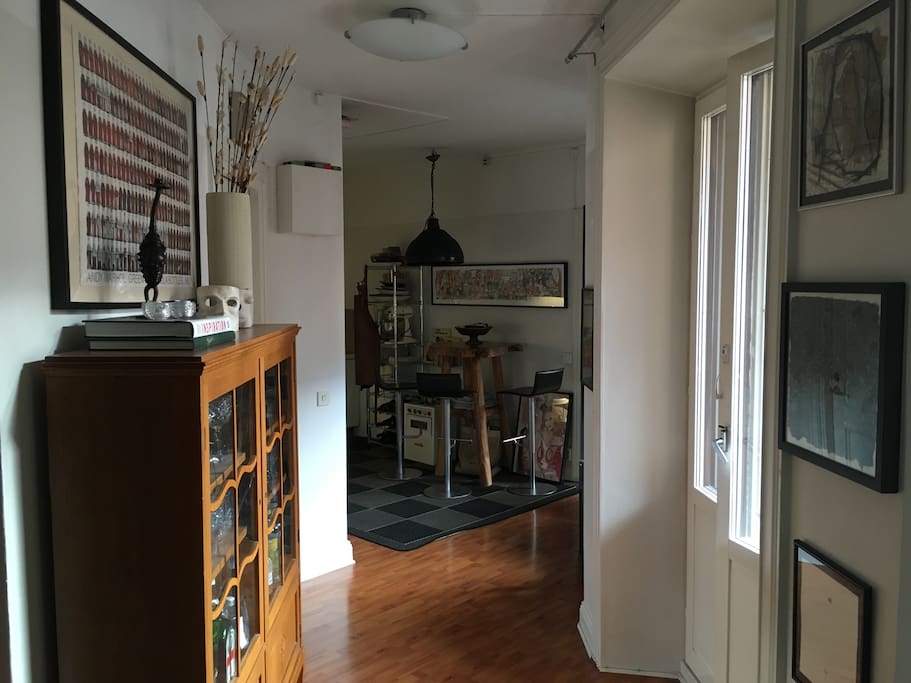 Hallway towards kitchen, balcony.