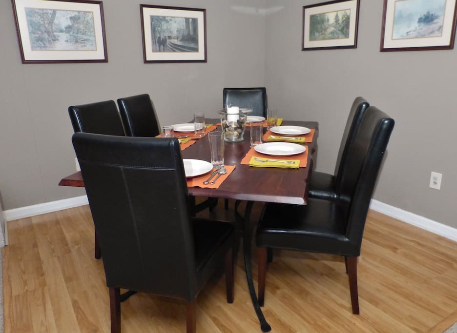 The dining area has a table that seats six.