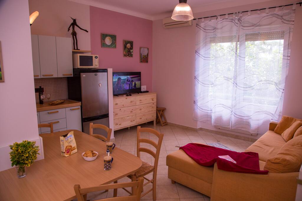 Here is a living room and a kitchen